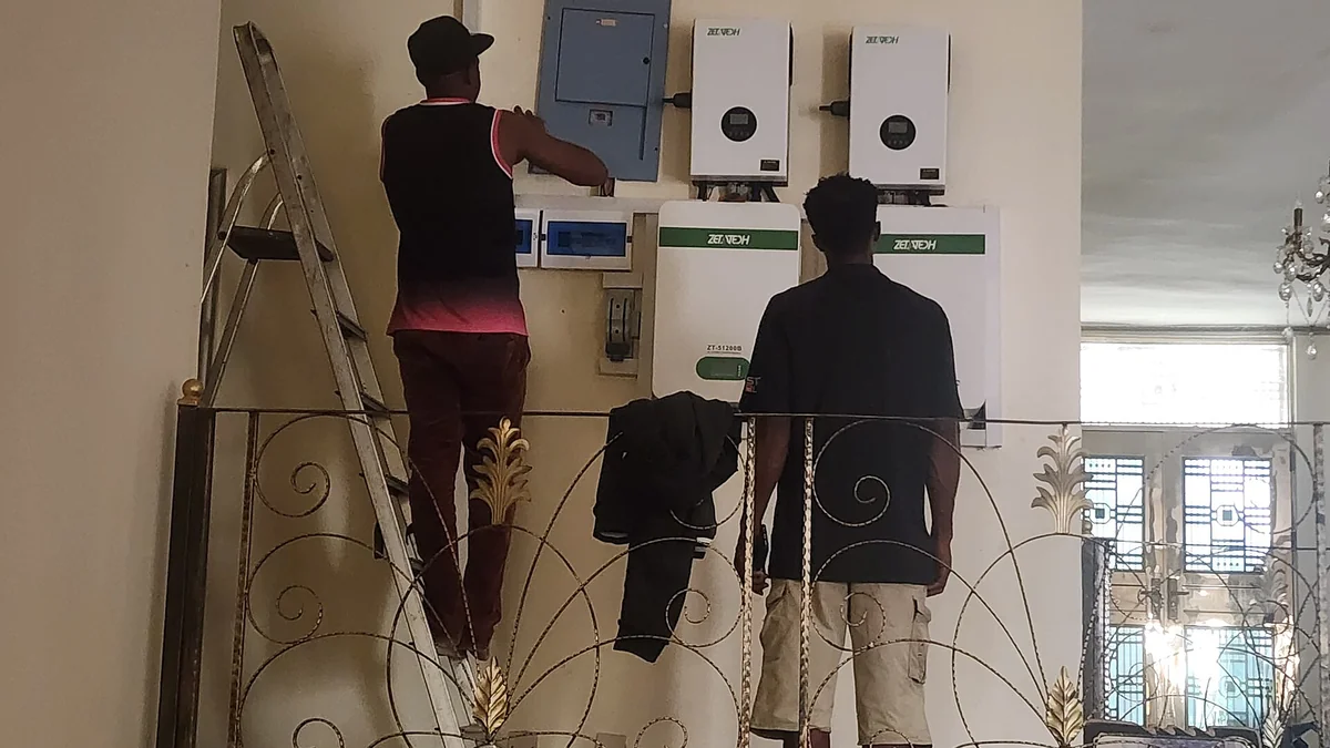 Installers setting up solar inverters with remote management capability