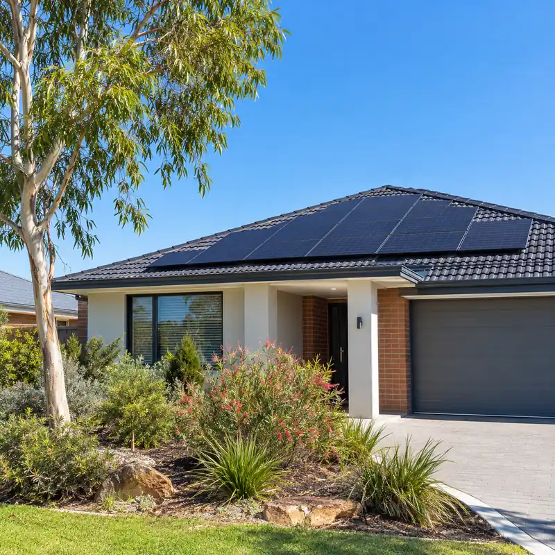 Perth home with rooftop solar panels in the midday sun